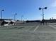 Well-maintained tennis court with modern lighting at 6303 Green Oak Cir, Bradenton, FL 34203