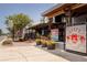 Charming Rusty Lyon restaurant exterior with outdoor seating and welcoming ambiance on a sunny day at 706 Hickory Dr, Dunedin, FL 34698