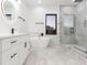 Elegant bathroom featuring a freestanding tub and walk-in shower at 716 S Lois Ave, Tampa, FL 33609