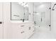 Clean bathroom with white vanity, black fixtures, and glass shower at 716 S Lois Ave, Tampa, FL 33609