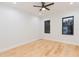 Bright bedroom with hardwood floors and ceiling fan at 716 S Lois Ave, Tampa, FL 33609