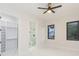 Bedroom with en-suite bathroom and walk-in closet at 716 S Lois Ave, Tampa, FL 33609