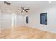 Bright bedroom with hardwood floors and ceiling fan at 716 S Lois Ave, Tampa, FL 33609