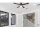 Spacious bedroom with access to staircase and view to kitchen at 716 S Lois Ave, Tampa, FL 33609
