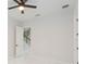 Simple bedroom with access to staircase and hallway at 716 S Lois Ave, Tampa, FL 33609