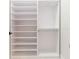 Large walk-in closet with shelving and hanging rod at 716 S Lois Ave, Tampa, FL 33609