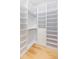 Large walk-in closet, built-in shelving and hanging rods at 716 S Lois Ave, Tampa, FL 33609