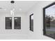 Bright dining room with modern chandelier and large windows at 716 S Lois Ave, Tampa, FL 33609