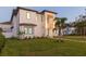 Contemporary two-story house with a metal roof and palm trees at 716 S Lois Ave, Tampa, FL 33609