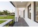 Modern front porch with dark tile flooring and metal railing at 716 S Lois Ave, Tampa, FL 33609