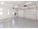 Two-car garage with epoxy floor and ample storage space at 716 S Lois Ave, Tampa, FL 33609