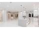 Open concept kitchen with a large island and modern finishes at 716 S Lois Ave, Tampa, FL 33609
