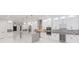 Modern kitchen with white cabinets, marble countertops and stainless steel appliances at 716 S Lois Ave, Tampa, FL 33609