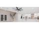 Open concept living room with modern kitchen and staircase at 716 S Lois Ave, Tampa, FL 33609