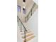 Modern staircase with glass and metal railing and chandelier at 716 S Lois Ave, Tampa, FL 33609