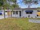 Charming single story home with a newly renovated exterior and landscaped lawn at 7405 41St Ave N, St Petersburg, FL 33709