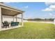 Spacious backyard with pond view at 7423 Northern Lights Dr, Gibsonton, FL 33534