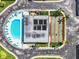 Aerial view showing pool, shuffleboard, and building at 7865 38Th N Pl, St Petersburg, FL 33709