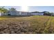 Large backyard with view of the house at 811 Camellia Ave, Ellenton, FL 34222