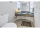 Clean bathroom with a granite vanity and a window at 811 Camellia Ave, Ellenton, FL 34222