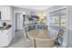Bright dining area with a round table and chairs, adjacent to the kitchen at 811 Camellia Ave, Ellenton, FL 34222