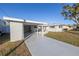 Exterior view of a single story home with carport and landscaped yard at 811 Camellia Ave, Ellenton, FL 34222