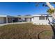 Charming ranch home with covered carport and landscaping at 811 Camellia Ave, Ellenton, FL 34222