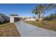 Ranch-style home with carport and landscaped yard at 811 Camellia Ave, Ellenton, FL 34222
