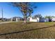 Ranch style home with carport and spacious front yard at 811 Camellia Ave, Ellenton, FL 34222