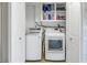 Laundry room with washer, dryer, and shelving for storage at 811 Camellia Ave, Ellenton, FL 34222