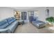 Relaxing living room featuring comfortable seating and a view into the kitchen at 811 Camellia Ave, Ellenton, FL 34222