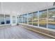 Sunroom with water view and laminate flooring at 811 Camellia Ave, Ellenton, FL 34222