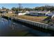 House's backyard with a view of the canal and private dock at 811 Camellia Ave, Ellenton, FL 34222