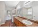 Bathroom with double vanity, shower, and garden tub at 8442 Lagerfeld Dr, Land O Lakes, FL 34637