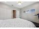 Bedroom with a double bed, ceiling fan, and built-in closet at 8442 Lagerfeld Dr, Land O Lakes, FL 34637