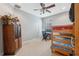 Cozy bedroom with bunk beds and a ceiling fan at 8442 Lagerfeld Dr, Land O Lakes, FL 34637