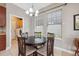 Charming dining area with table and chairs, adjacent to kitchen at 8442 Lagerfeld Dr, Land O Lakes, FL 34637
