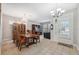 Bright dining room featuring a large table and chandelier at 8442 Lagerfeld Dr, Land O Lakes, FL 34637