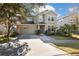 Two-story house with a two car garage and manicured lawn at 8442 Lagerfeld Dr, Land O Lakes, FL 34637