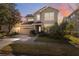 Two-story house with gray siding, attached garage, and landscaping at 8442 Lagerfeld Dr, Land O Lakes, FL 34637