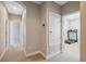 Upper level hallway with access to home gym at 8442 Lagerfeld Dr, Land O Lakes, FL 34637