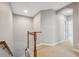 Spacious upstairs hallway with neutral decor at 8442 Lagerfeld Dr, Land O Lakes, FL 34637