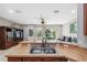 Kitchen with breakfast bar overlooking the living room at 8442 Lagerfeld Dr, Land O Lakes, FL 34637