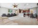 Open living room with comfy seating and kitchen views at 8442 Lagerfeld Dr, Land O Lakes, FL 34637