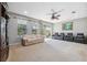 Relaxing living room with lake view and comfortable seating at 8442 Lagerfeld Dr, Land O Lakes, FL 34637