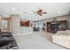 Spacious living room with hardwood floors, and access to the kitchen at 8442 Lagerfeld Dr, Land O Lakes, FL 34637