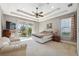 Bright main bedroom with access to patio and backyard at 8442 Lagerfeld Dr, Land O Lakes, FL 34637