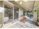 Covered patio with rocking chairs and access to backyard at 8442 Lagerfeld Dr, Land O Lakes, FL 34637