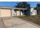 Ranch style home with attached garage and carport at 8757 113Th St, Seminole, FL 33772