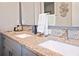 Double vanity bathroom with granite countertop and modern faucets at 946 Highland Ave # 1, Dunedin, FL 34698